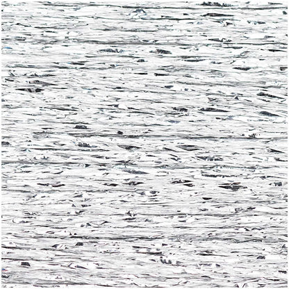 Close-up of shimmering silver metallic embroidery thread texture
