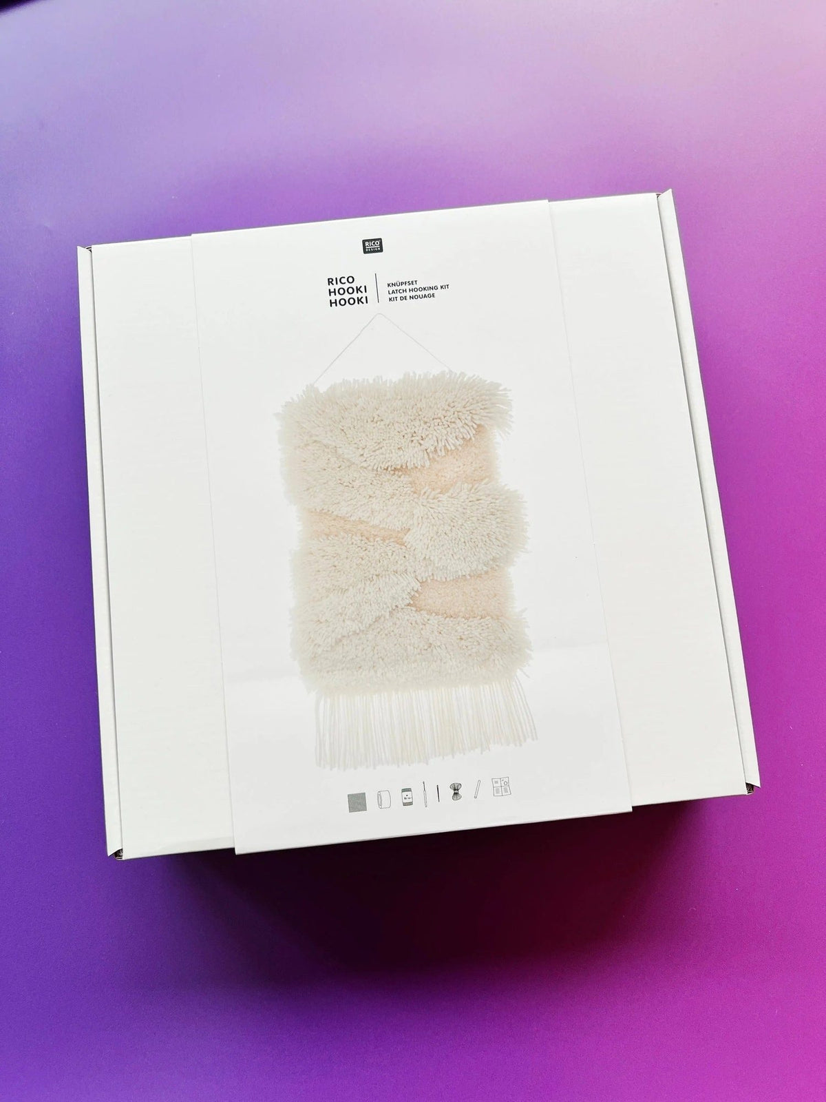 Latch hook rug kit with white landscape design by Rico Design