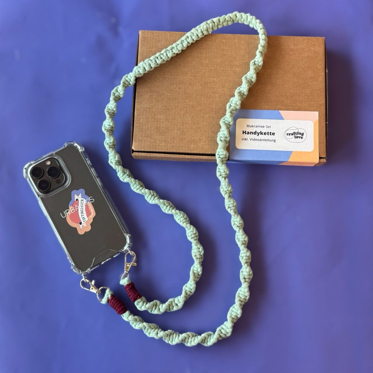 Macrame phone chain detail with knotted pattern