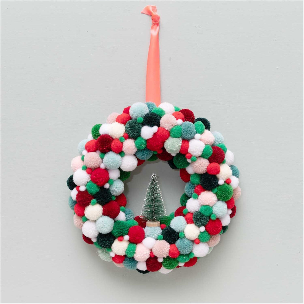 Red and green pom-poms scattered detail