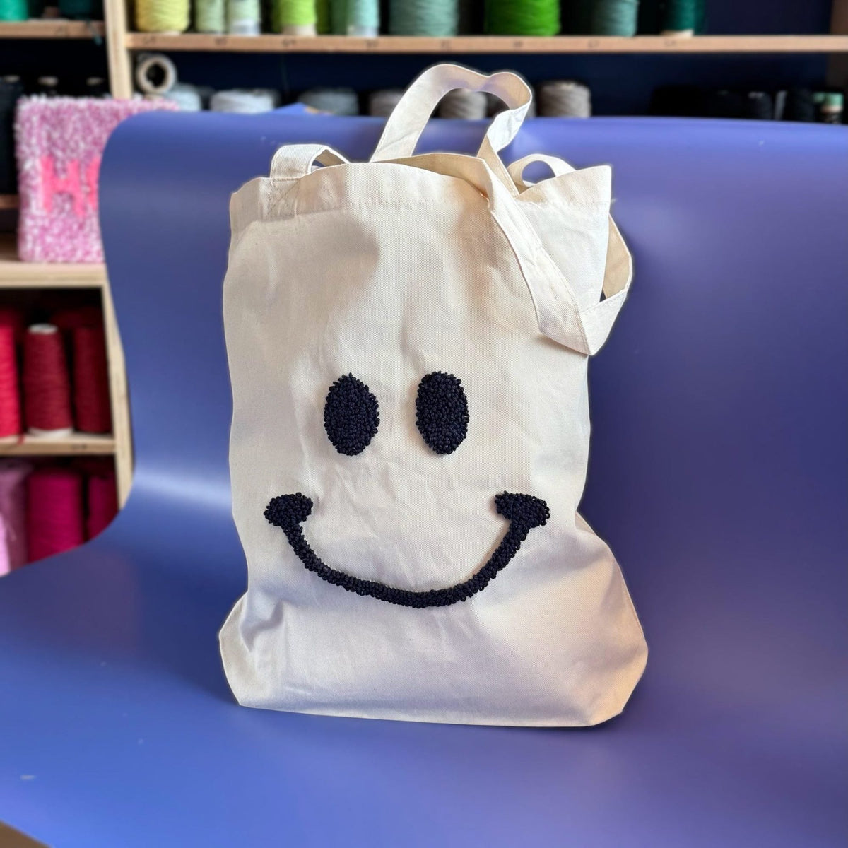 Smiley punch needle pattern for a tote bag